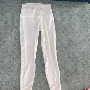 Lulu lemon cropped light pink leggings.